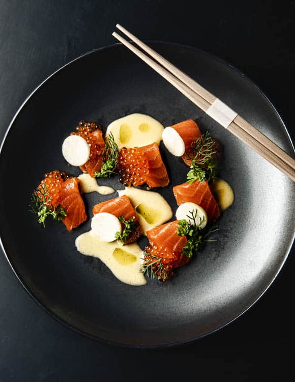 bowl of seafood with chopsticks