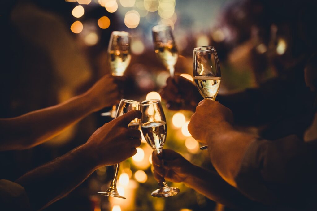 people toasting champagne to 