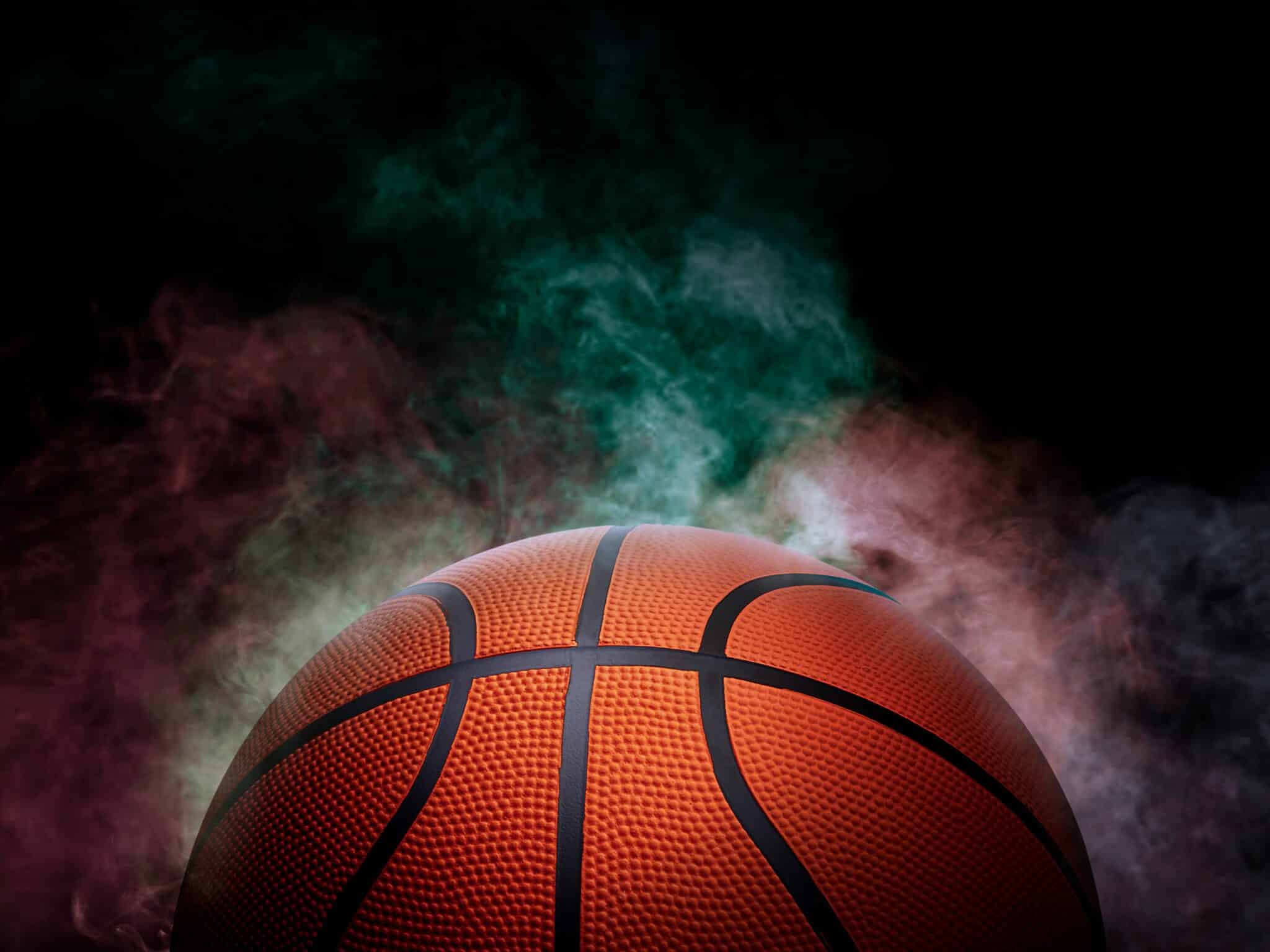 basketball with colored smoke coming from it