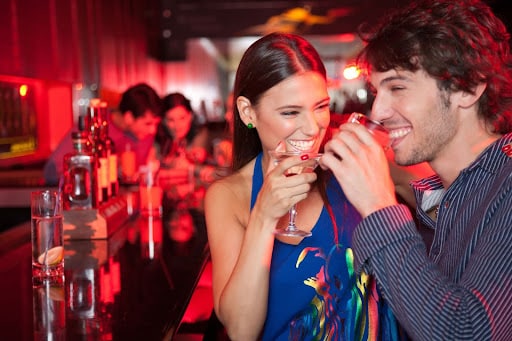 Couple drinking at a bar