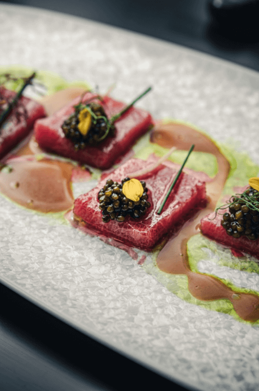 tuna on a plate with caviar on top