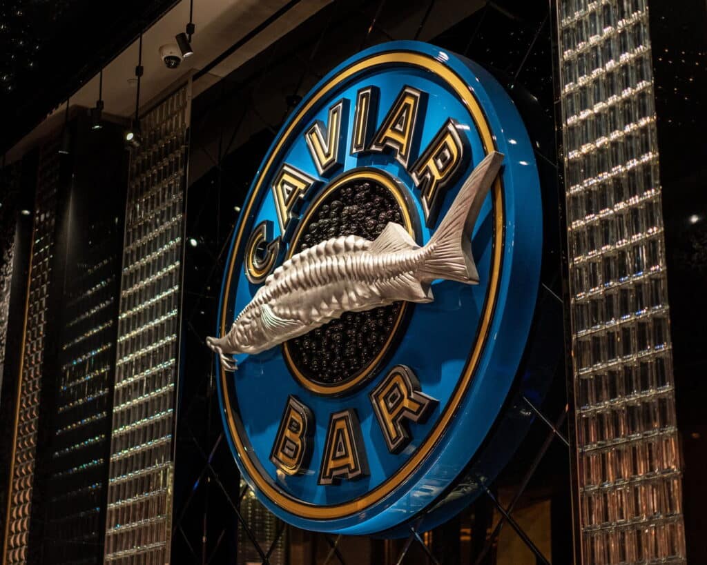 The sign for Aqua Seafood & Caviar Restaurant that hangs in the restaurant at Resorts World Las Vegas.