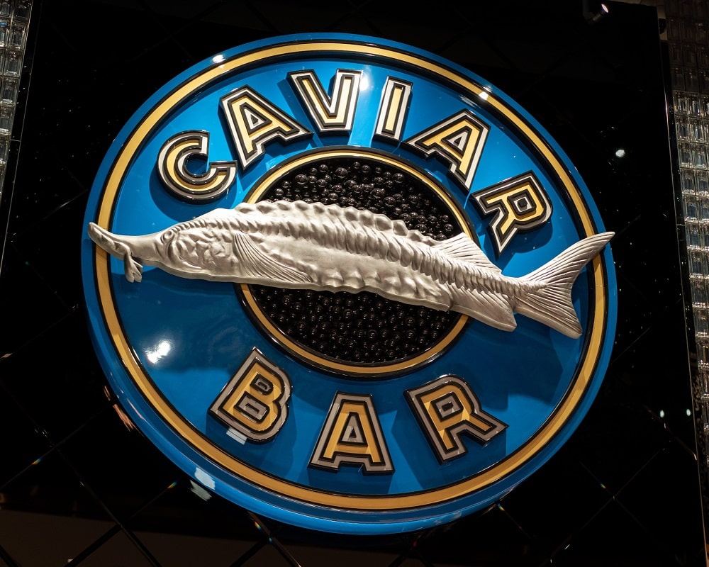The sign for Aqua Seafood & Caviar Restaurant, a kid-friendly restaurant.