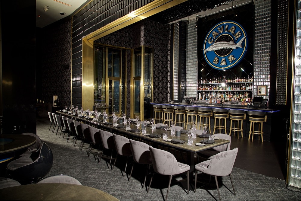 Indoor group seating at Aqua Seafood & Caviar Restaurant.