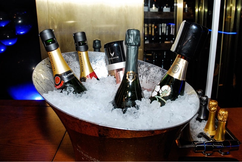 Bottles of champagne in a bucket of ice at Aqua Seafood & Caviar Restaurant.